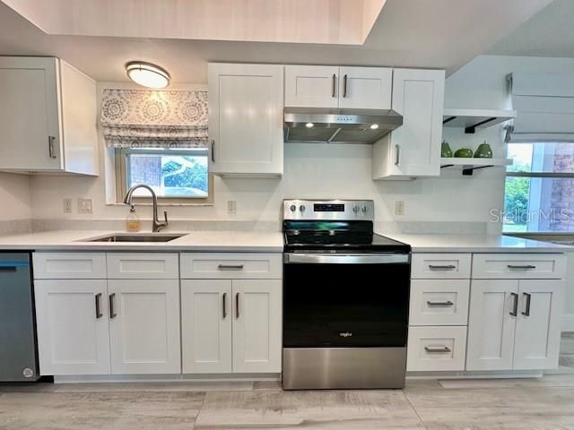 WHITE SOLID WOOD CABINETS AND NEW S/S APPLIANCES