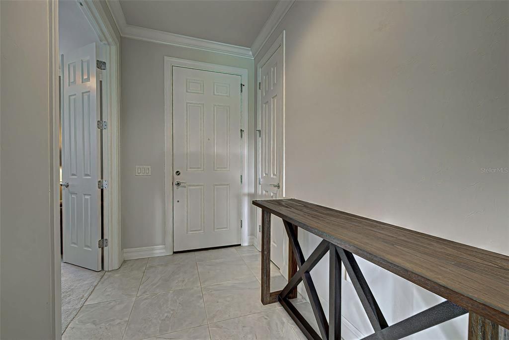 Welcoming foyer with crown molding