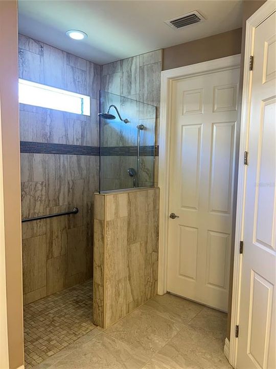 Renovated direct access shower with grab bar