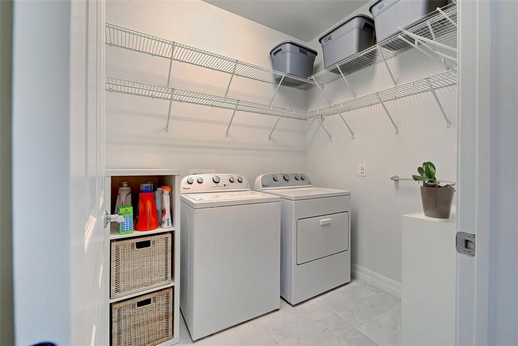 Equipped laundry room with additional storage