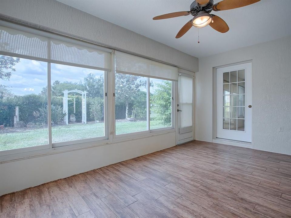 SUN SHADES AND GORGEOUS FLOORING THROUGHOUT