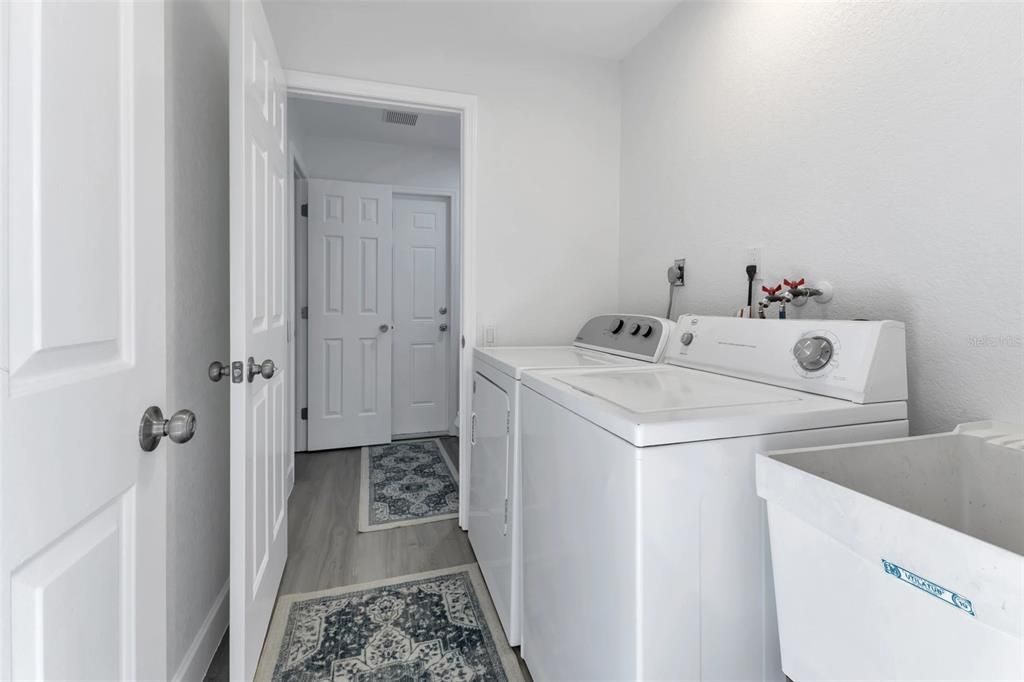 inside laundry room with utility sink