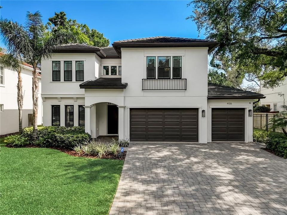 Huge pavered driveway to 3 car garage, irrigation and mature landscaping with up lighting.