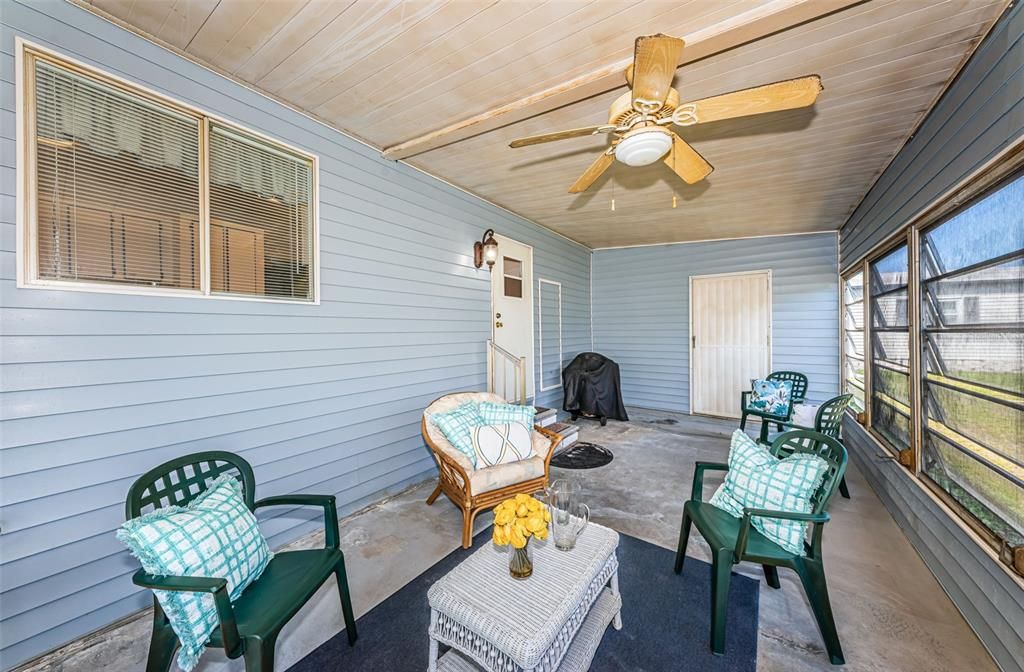 Screen in side porch with storage shed