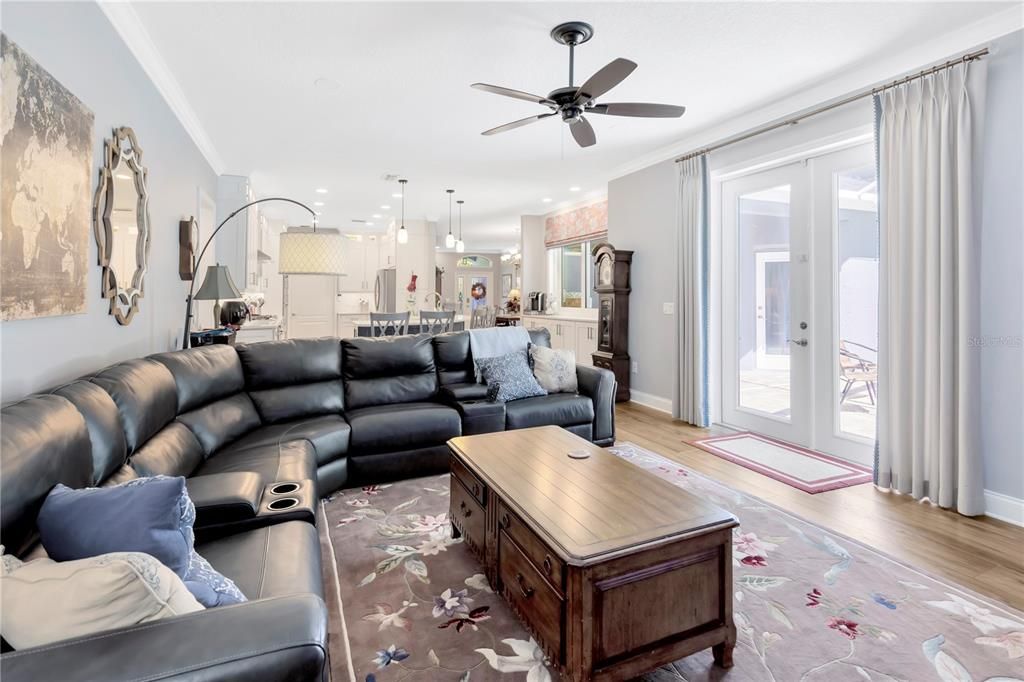 Large family room with French doors leading out to the pool area!