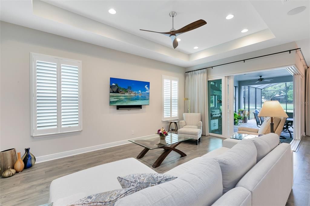 With high ceilings, additional recessed lighting, and surround sound, this area is perfect for both relaxation and entertaining.