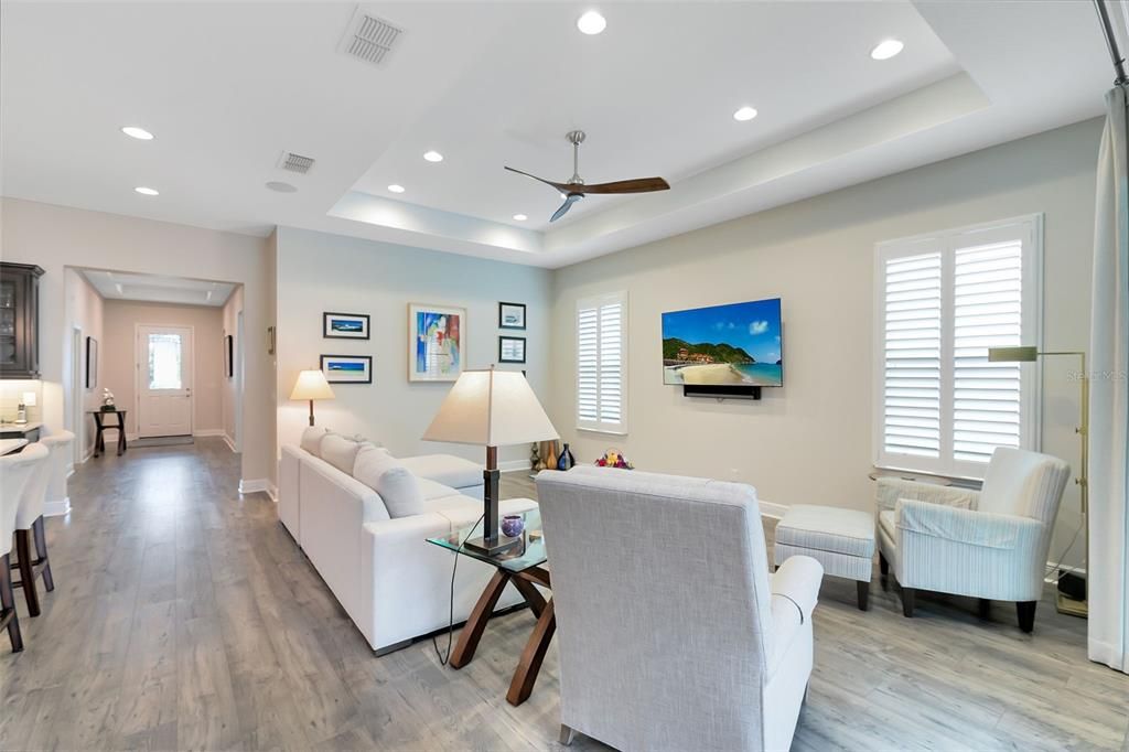 With high ceilings, additional recessed lighting, and surround sound, this area is perfect for both relaxation and entertaining.