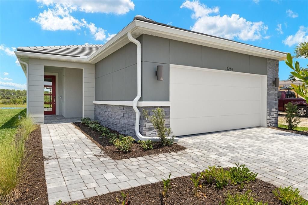 Front Entry With Paver Walkway and Drive