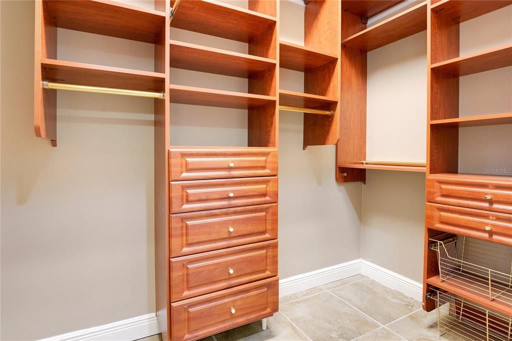 Dual walk in closets on the way to the private ensuite.