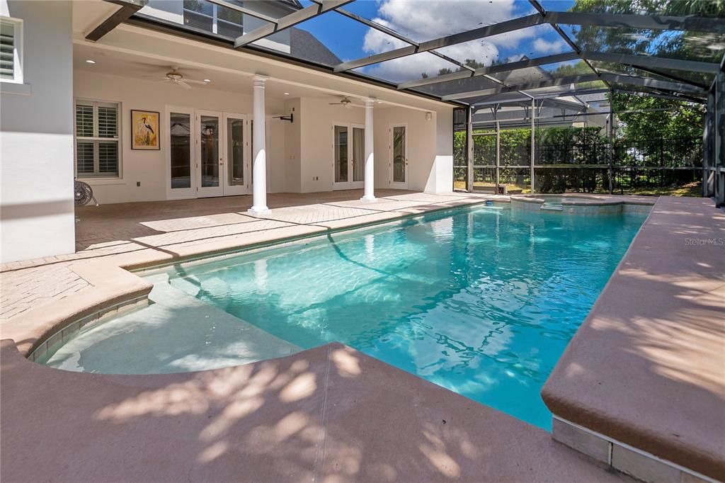 Large, screened in pool with spa.