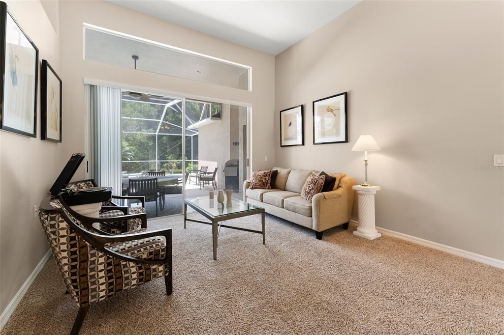 Lovely Formal Living Room Space With Pool Views