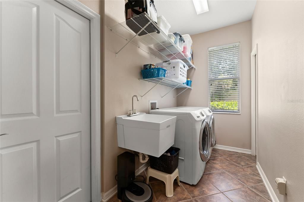 Laundry Room With Closet Space, Shelving & Laundry Tub