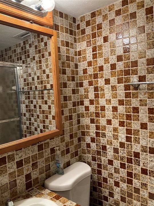 tiled master bathroom