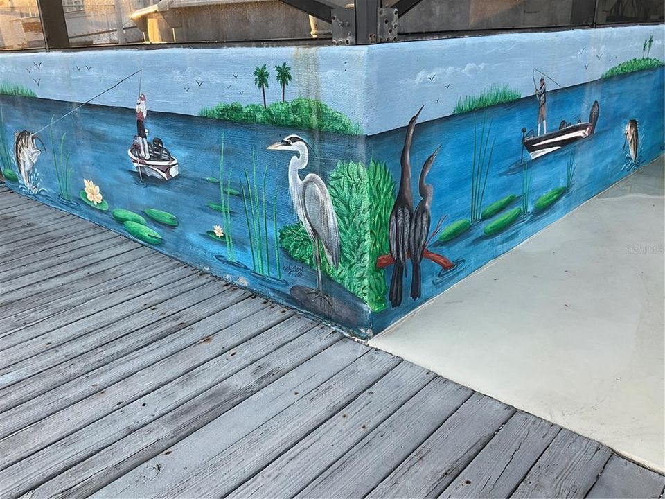 Hand painted concrete wall around pool enclosure