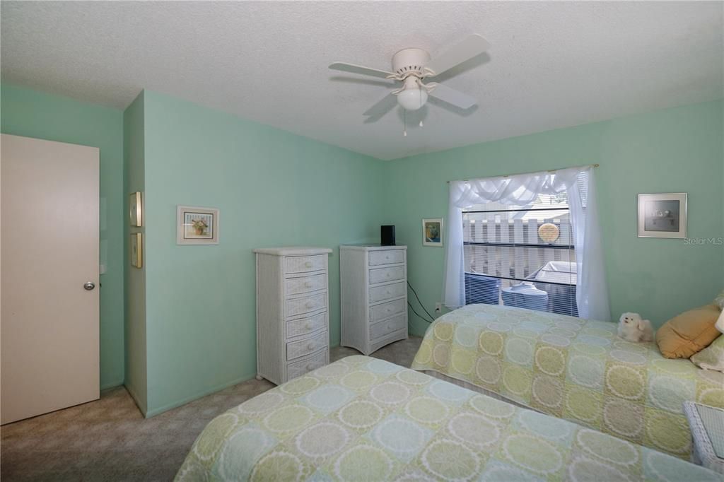 Along with twin beds, you can have dressers in this spacious guest room.