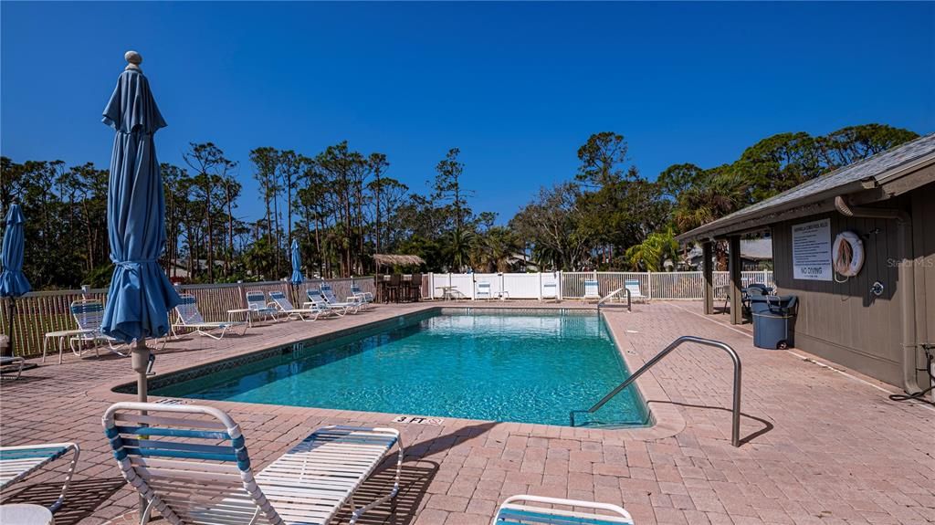 Beautiful large community pool with plenty of patio space to sit and relax in the sun.