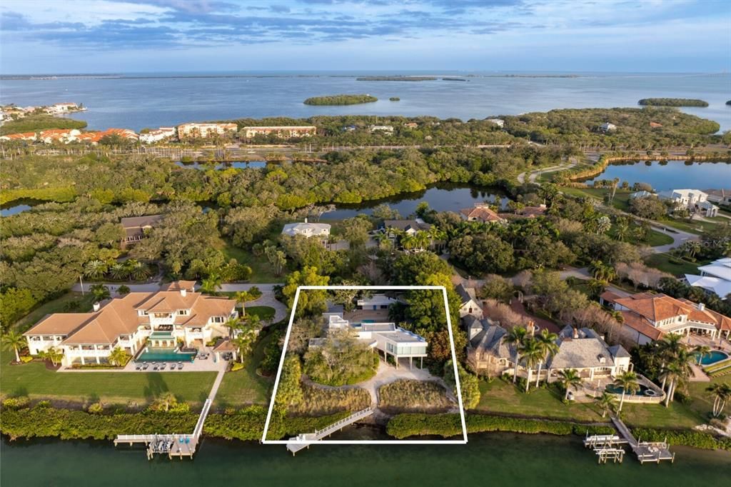 Discover almost an acre of pristine waterfront land situated on one of the most desirable streets in Pinellas County.