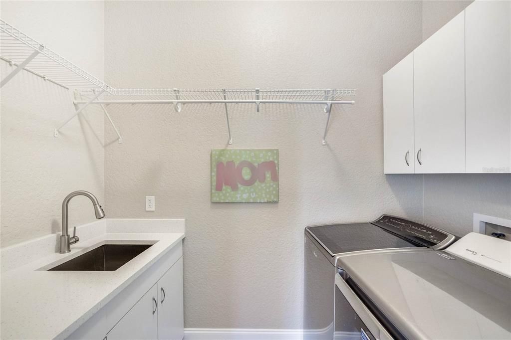 Laundry Room with Quartz Countertop and Sink