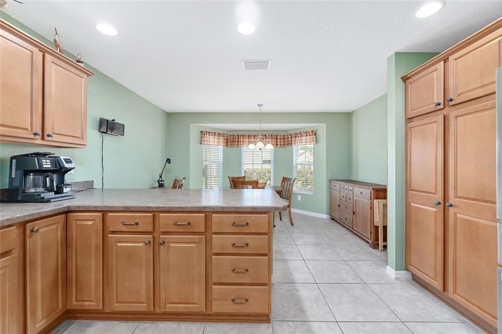 KITCHEN HAS STAINLESS STEEL APPLIANCES, WINDOW OVER SINK AND EASY ACCESS TO DINING ROOM