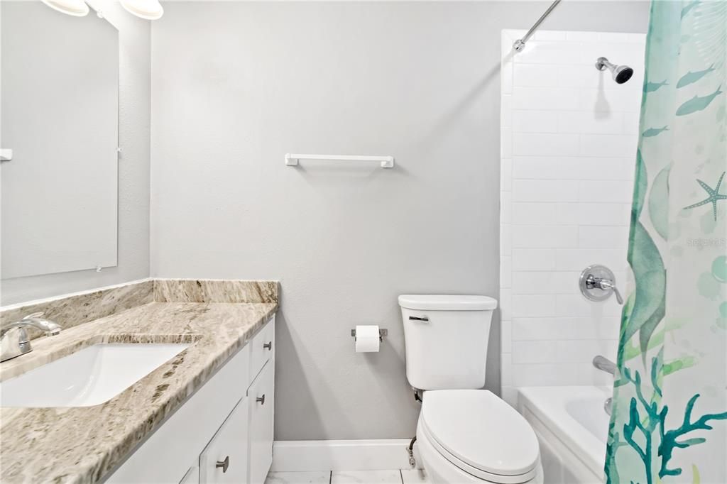 Guest bathroom, new sink, granite countertop, comfort heigt toilet, new subway tile surrounding tub/shower