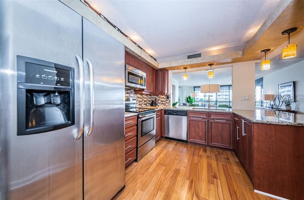 Kitchen is equipped with stainless steel appliances.