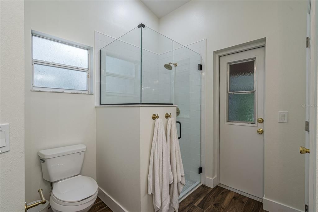 Primary Bathroom - Shower Only - Door leads to the Lanai overlooking the Pool and Backyard