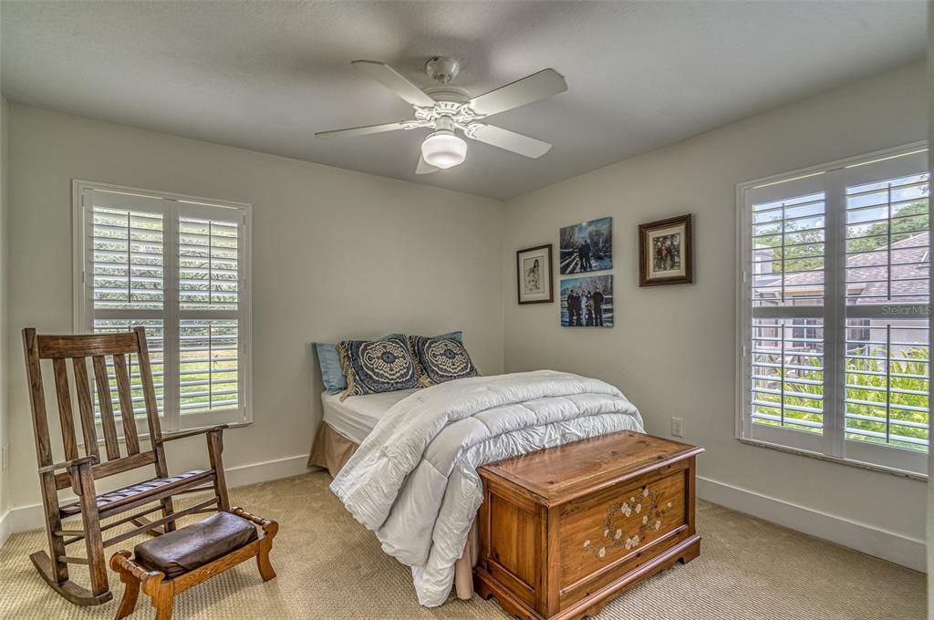 Bedroom 3 - Great views of the Pool and backyard. - Plantation Shutters and Carpet Flooring