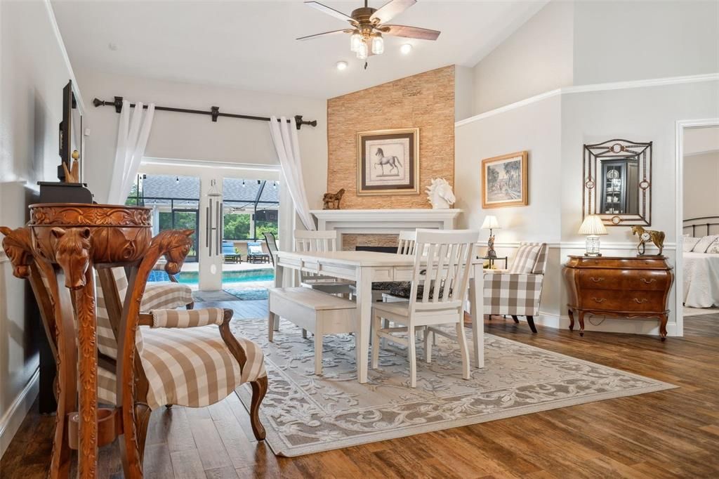 "Hearth Room" currently houses an extra large dining room table and a cozy reading nook in front of a wood burining fireplace. Consider this a large flex-use family room.