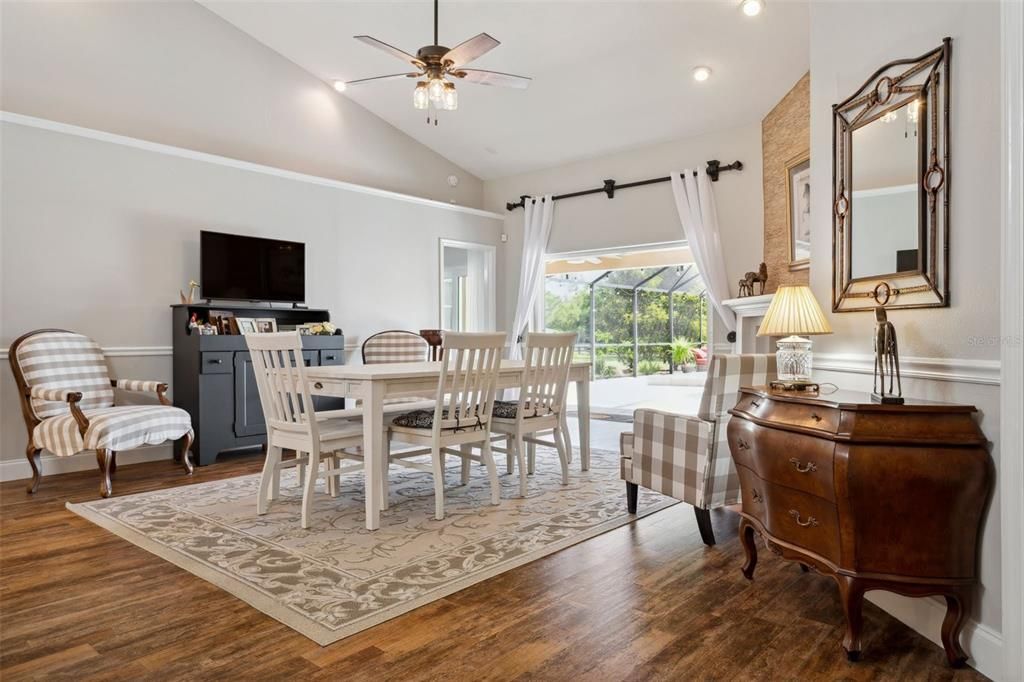 "Hearth Room" currently houses an extra large dining room table and a cozy reading nook in front of a wood burining fireplace. Consider this a large flex-use family room.