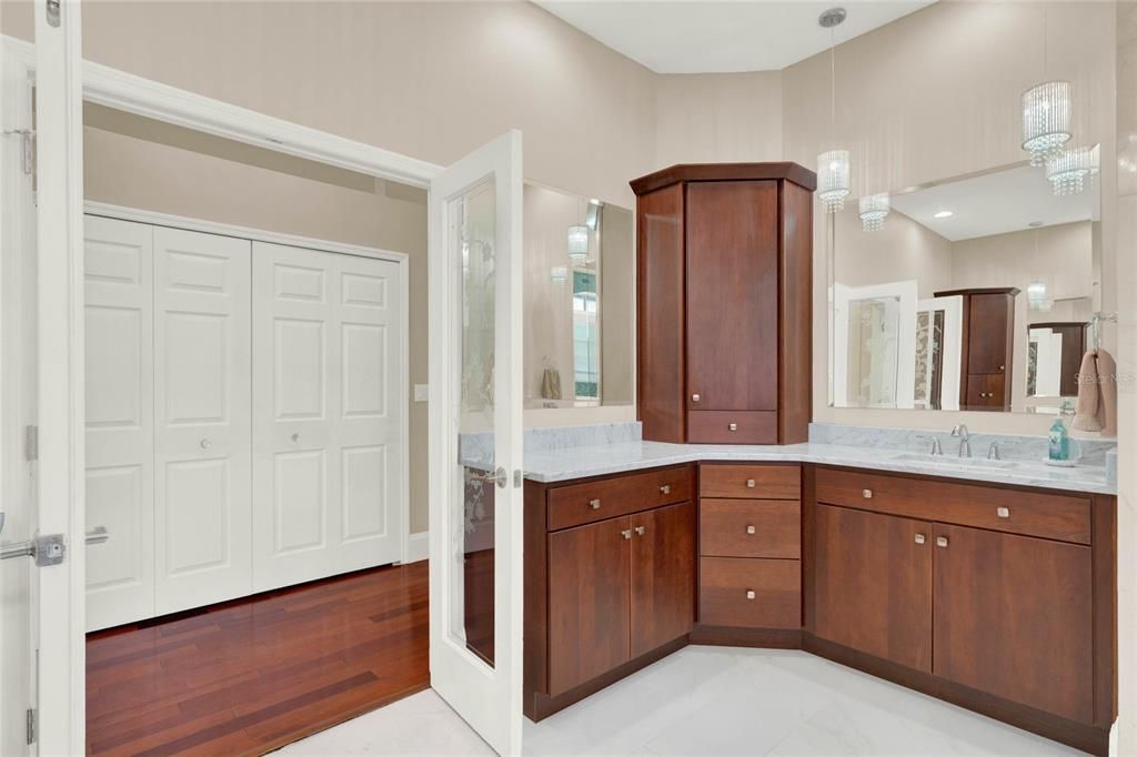 Dual vanities with upper and lower cabinetry for plenty of storage