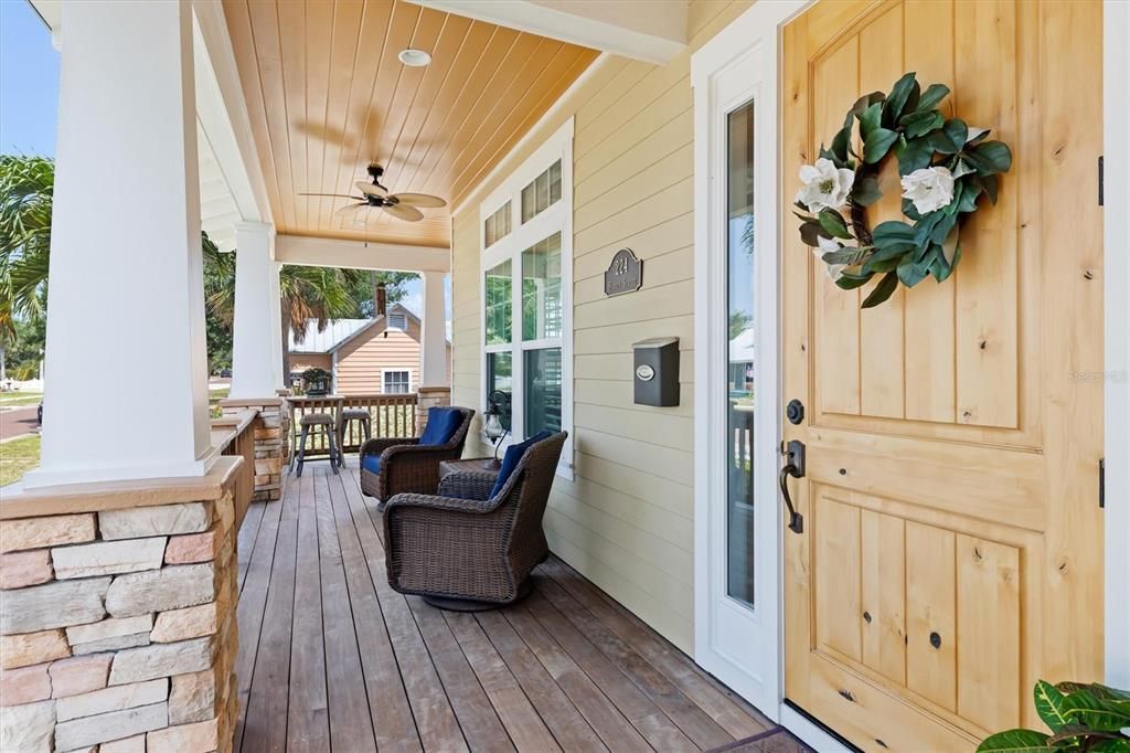 The custom Cypress ceilings are just one of the charming features of this welcoming year-round porch