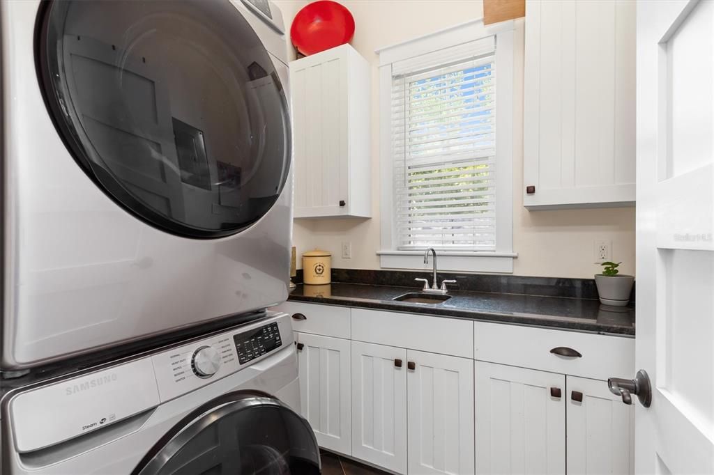 Fully equipped laundry room with ample storage
