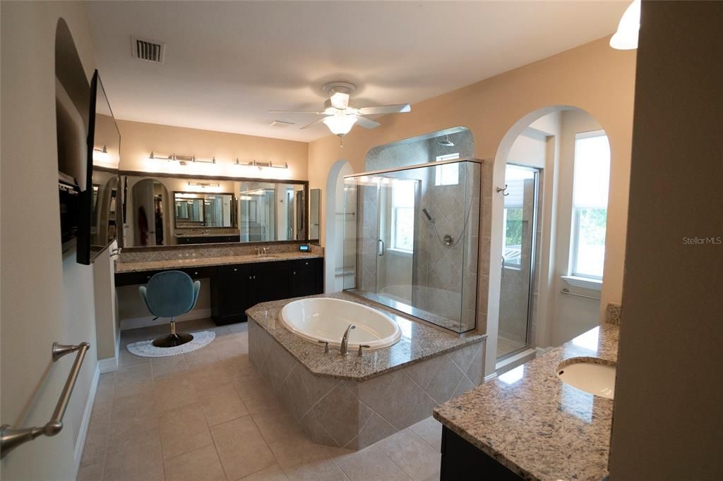 Master bathroom with soaking tub and two door shower