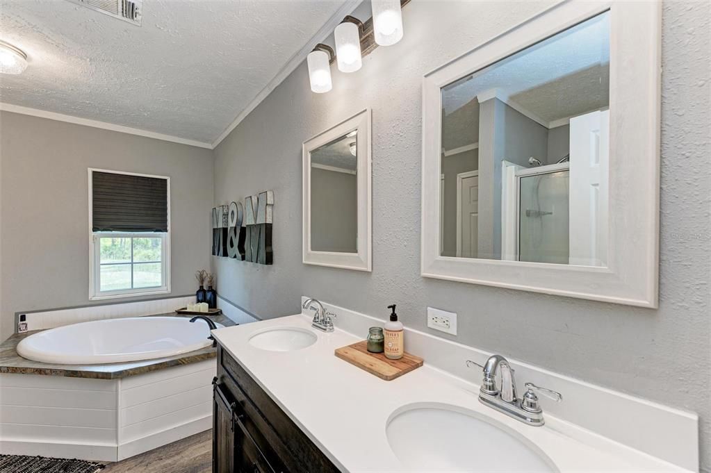 Ensuite bathroom with double sinks, soaking tub and separate shower.