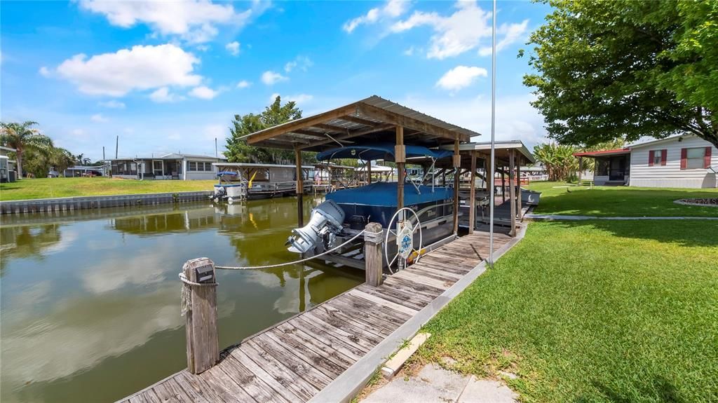 Dock on Lake Dora Canal currently holding a 7' x 14' pontoon boat