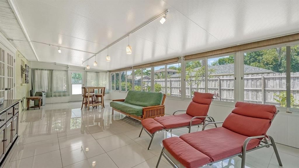 Spacious Florida Room featuring porcelain tile, water hookup, and views of your back yard!