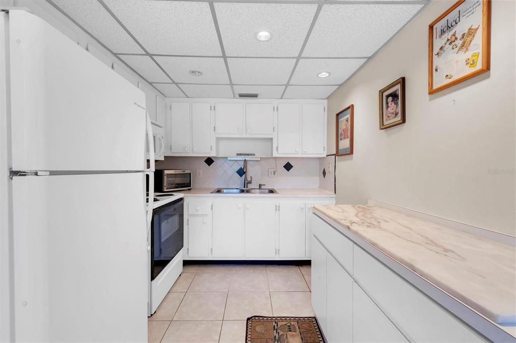 The kitchen has a disposal and additional storage. Cabinets are solid wood; this kitchen has a lot of storage capability. Dishwashers are not permitted.