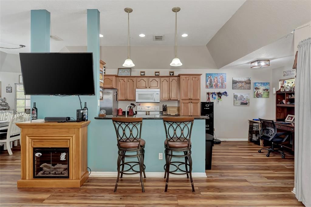 Family room and kitchen with breakfast bar in between