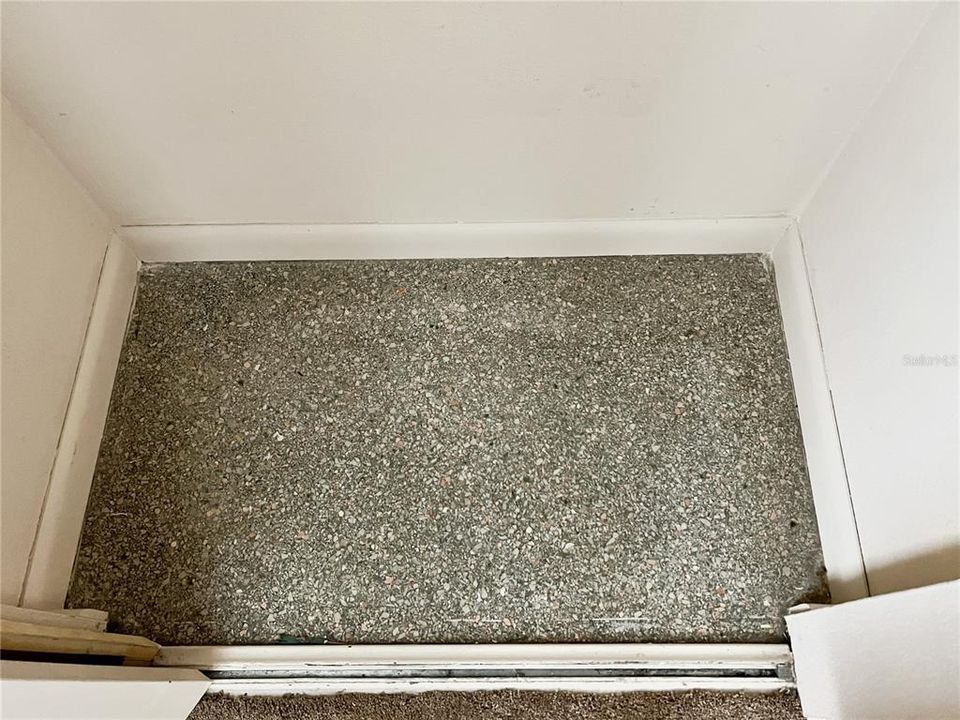 Terrazzo floors are found in each of the bedroom closets. They likely run throughout most, if not all, of the home and might possibly be restored.