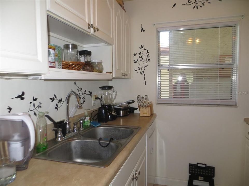 The kitchen is very bright and includes a dishwasher...