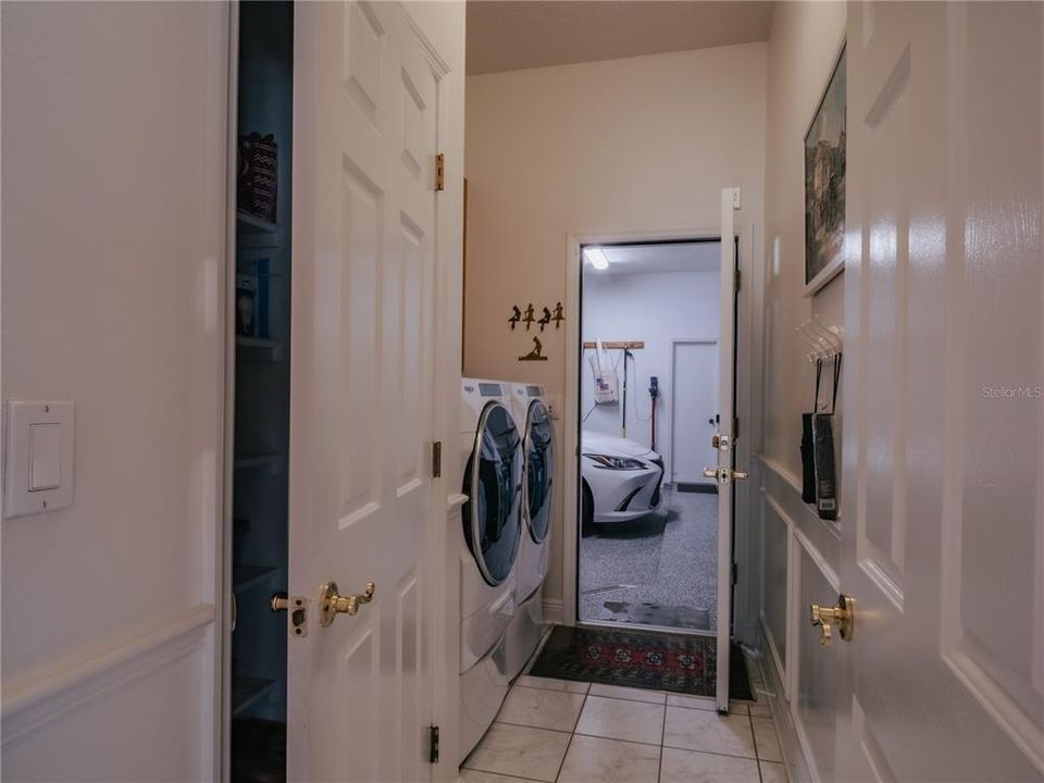 Laundry area, Large Spare Pantry, leading into 3 bay garage