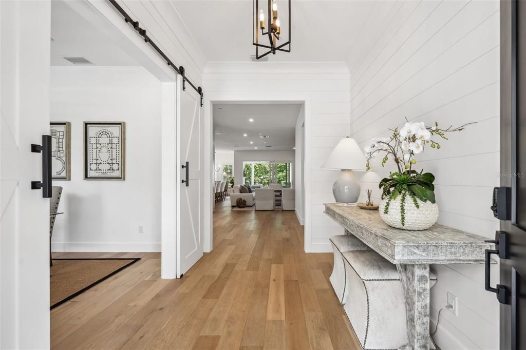 Foyer features beautiful shiplap & crown molding