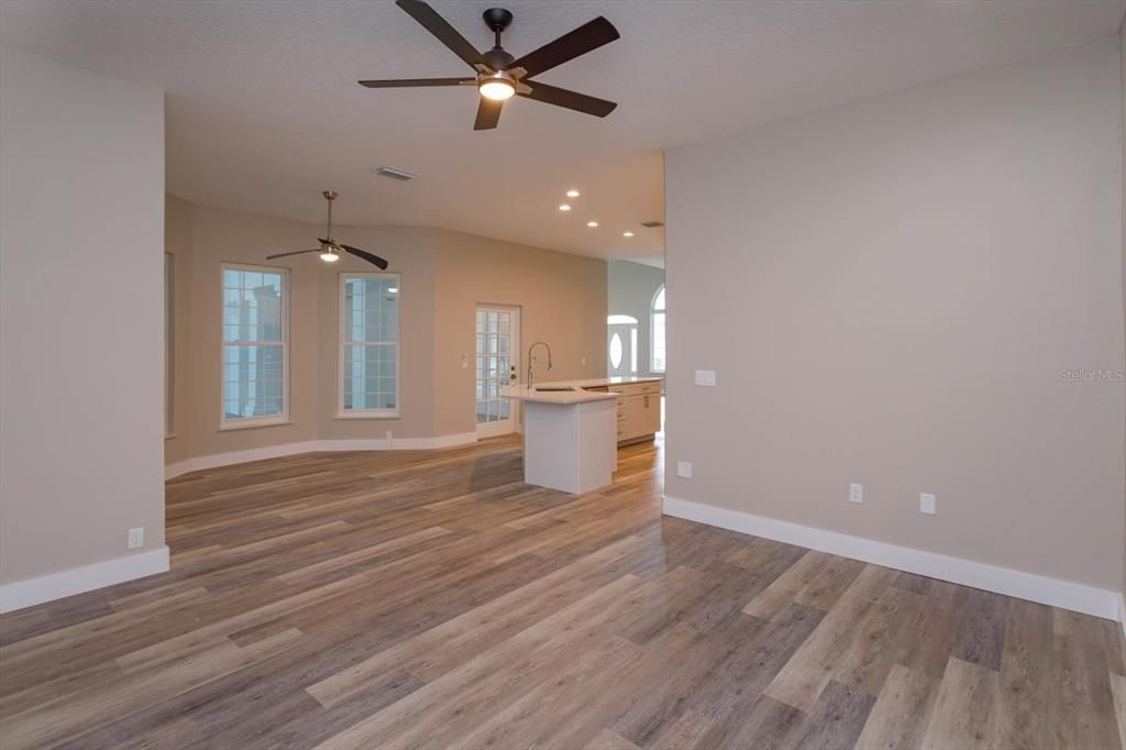 family living area off kitchen looking toward eat in kitchen area