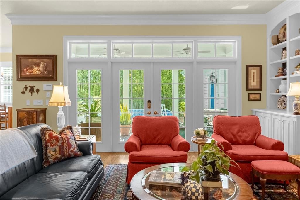 French doors to summer kitchen and pool.