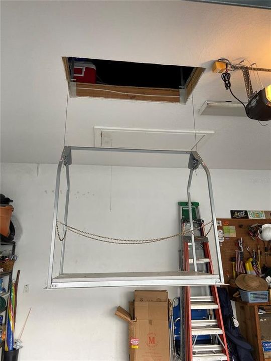 Electric lift in garage for easy attic storage!