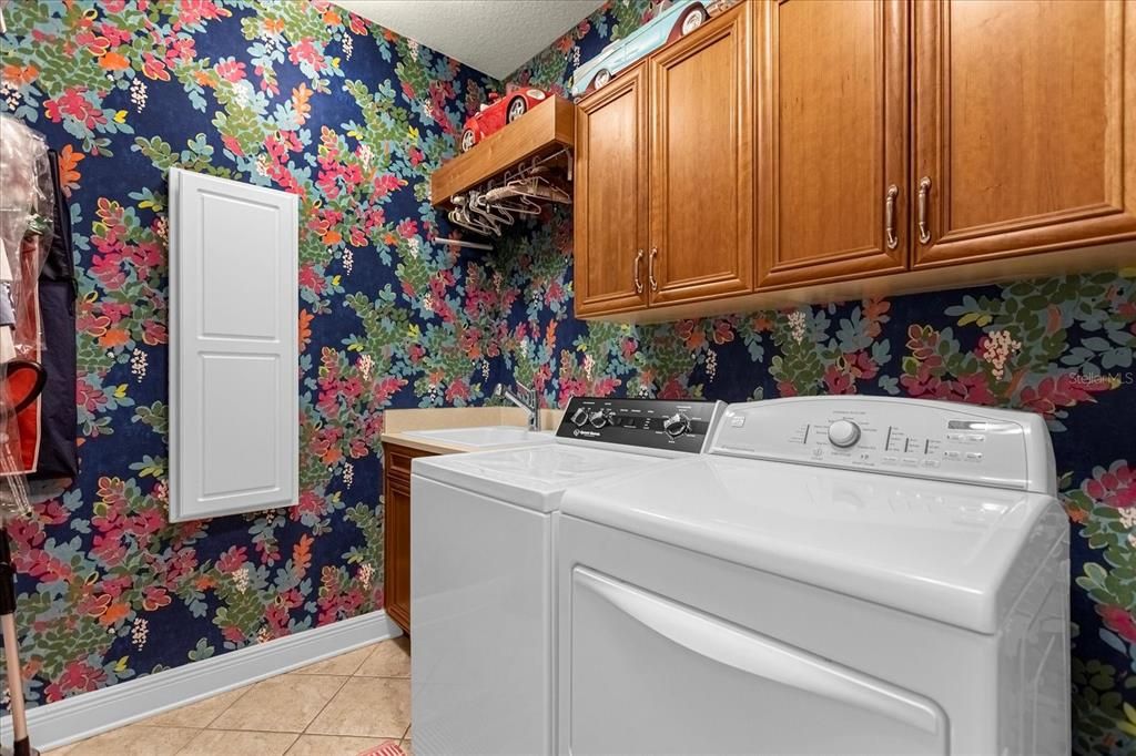 Upstairs laundry room w/built-in ironing board.  Not picture: built-in storage and drying rod.