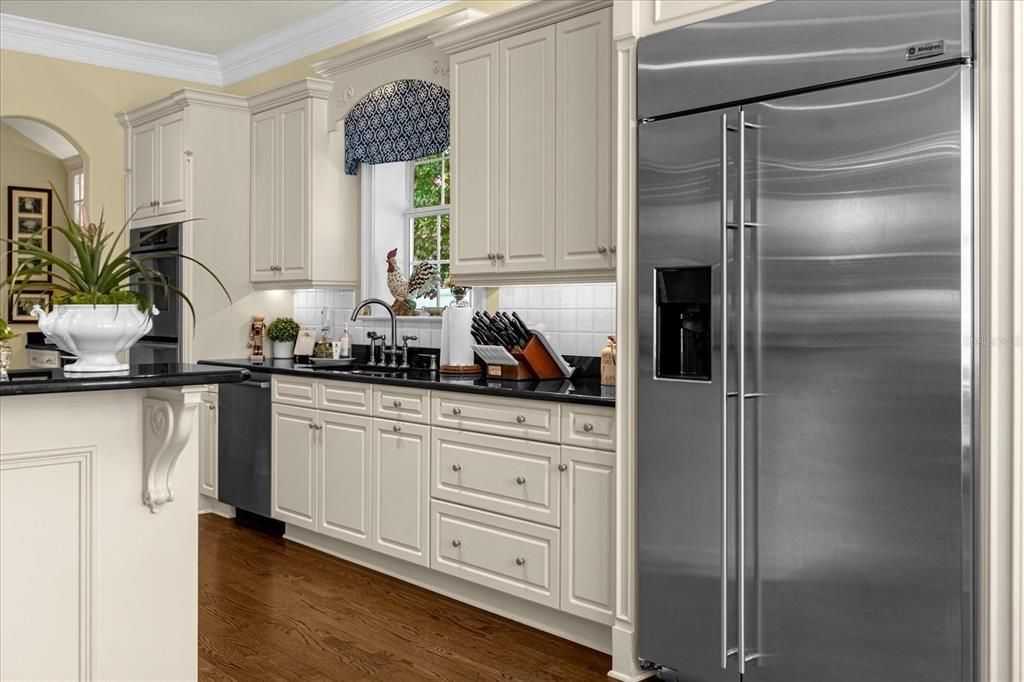 Kitchen with breakfast nook behind photographer