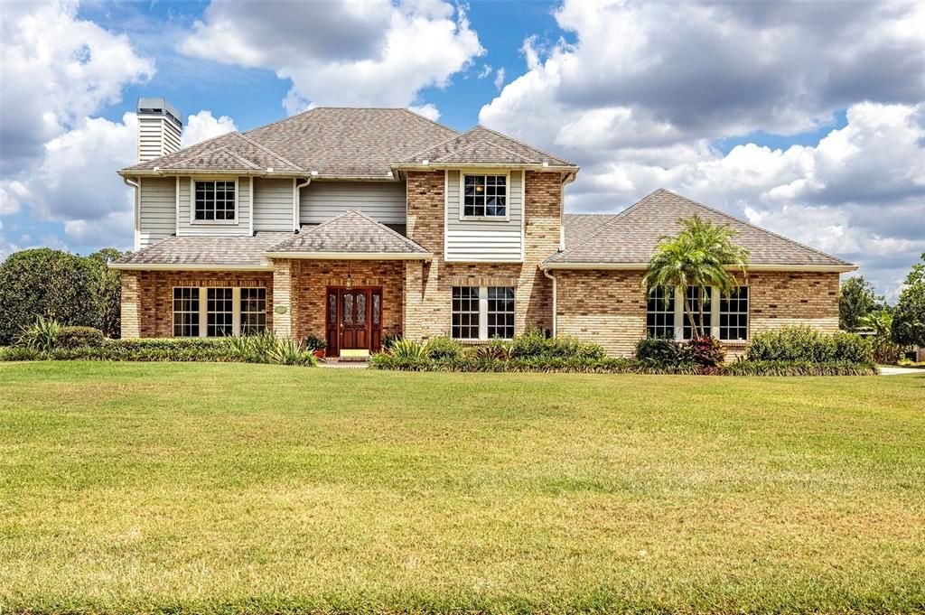 Front of home w/mature landscaping