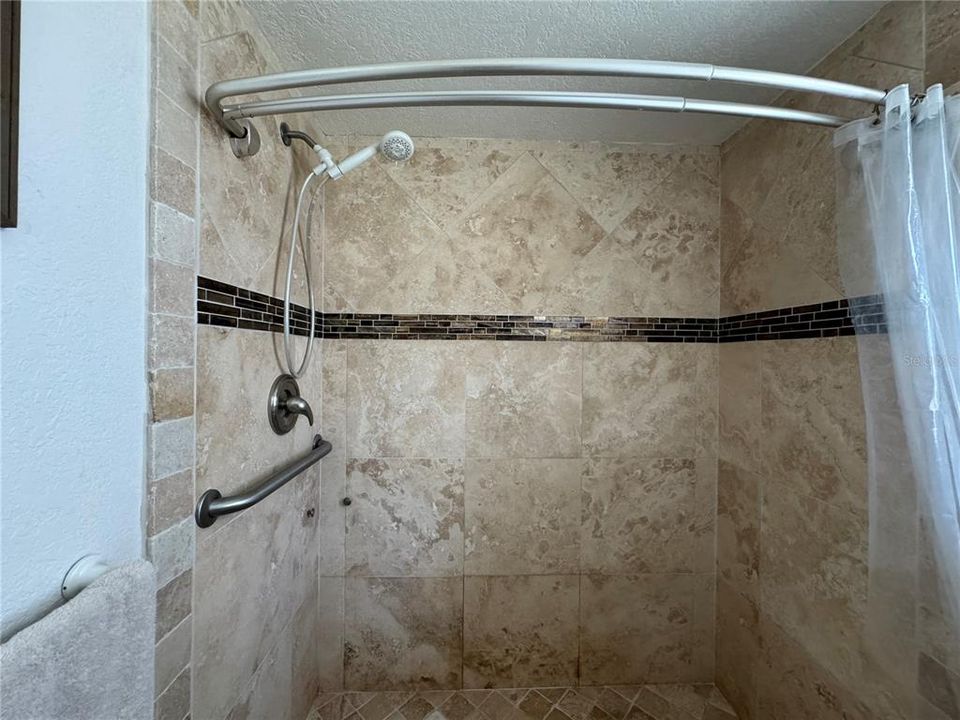 master bathroom shower w. travertin tile