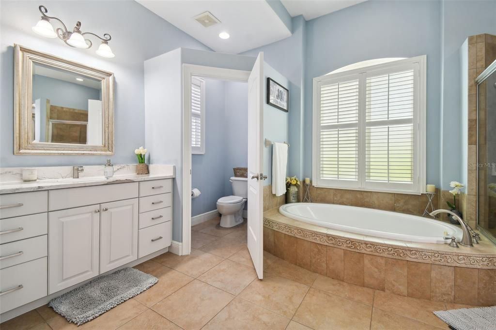 Owners suite attached bath with jacuzzi tub, separate shower, dual sinks & Water closet